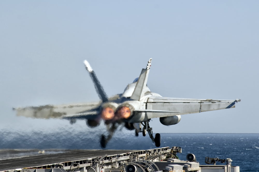 A FA-18F Super Hornet launches from the flight deck of aircraft carrier USS Nimitz Canvas Art - Giovanni CollaStocktrek Images (35 x 24)