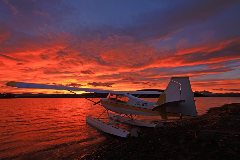 A Float Plane Facing The Sunrise Over Teslin Lake Yukon Canvas Art - Robert Postma Design Pics (34 x 22)