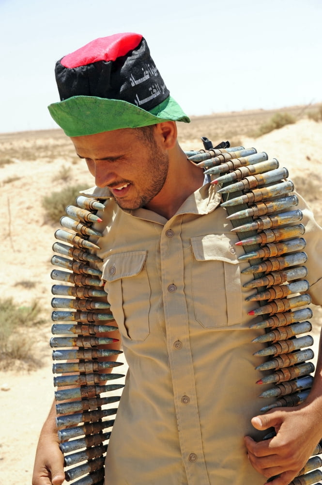 A Free Libyan Army soldier with an ammuntion belt of 30mm heavy machne gun rounds Canvas Art - Andrew ChittockStocktrek Images (23 x 35)