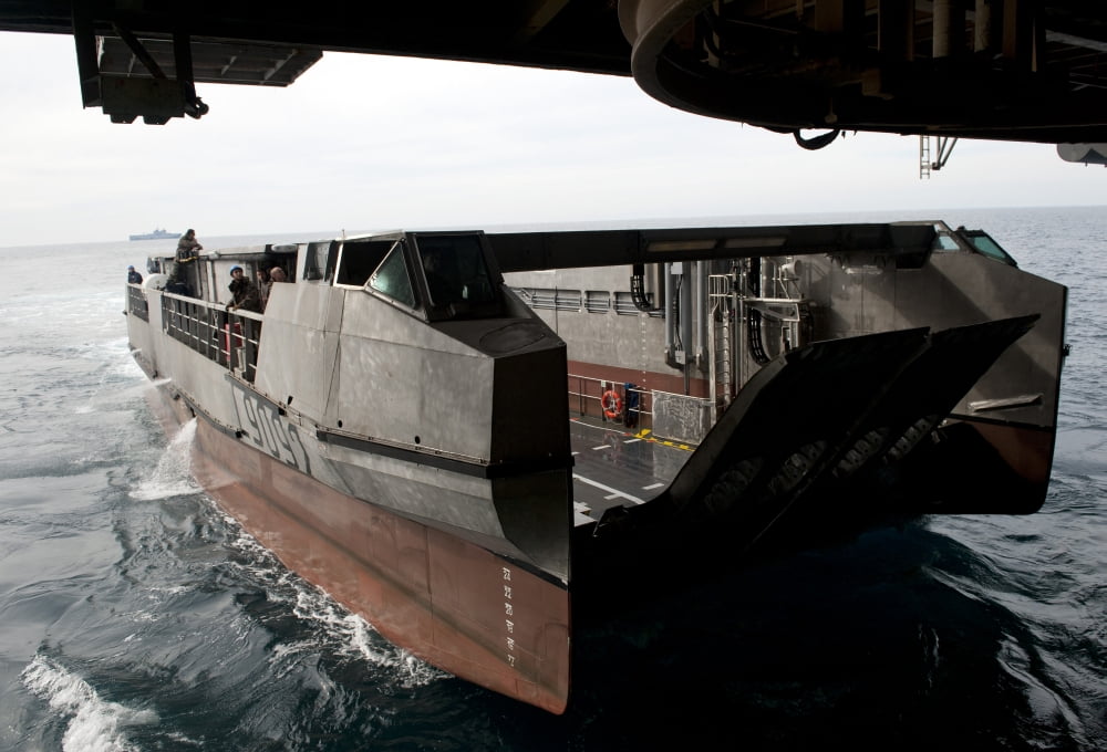 A French landing catamaran prepares to pull into the well deck of USS Wasp Canvas Art - Stocktrek Images (34 x 24)
