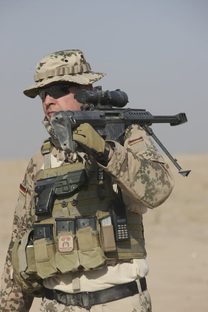 A German soldier carries a Barrett M82A1 rifle Canvas Art - Terry MooreStocktrek Images (24 x 35)