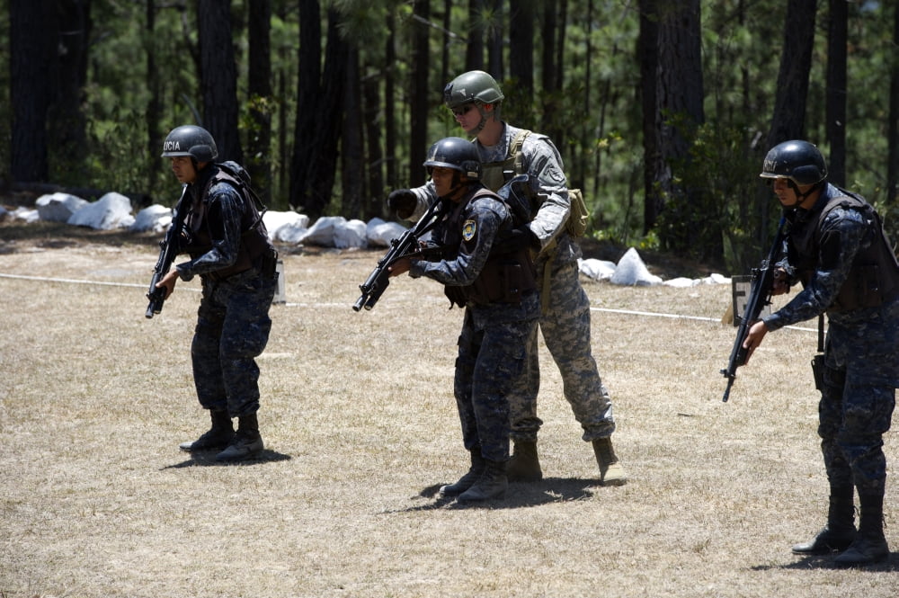 A Green Beret instructs TIGRES trainees during advanced rifle training Canvas Art - Stocktrek Images (34 x 23)