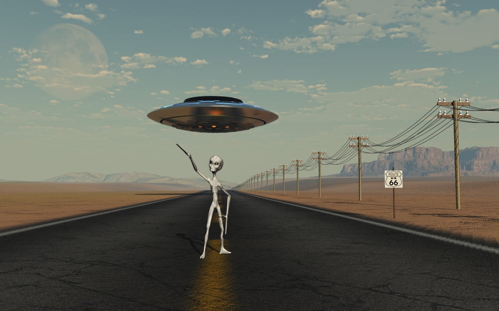 A Grey Alien hitching a ride from a passing UFO Canvas Art - Mark StevensonStocktrek Images (36 x 23)