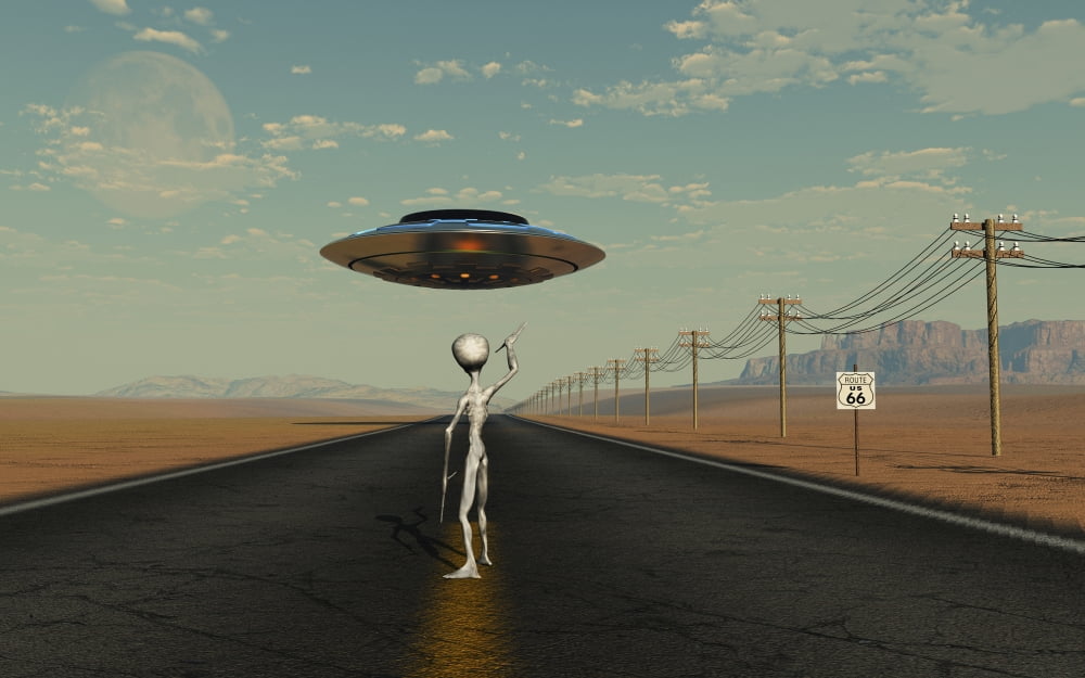 A Grey Alien hitching a ride from a passing UFO Canvas Art - Mark StevensonStocktrek Images (36 x 23)