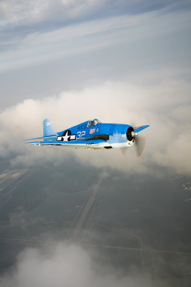 A Grumman F6F Hellcat fighter plane in flight Canvas Art - Scott GermainStocktrek Images (12 x 18)