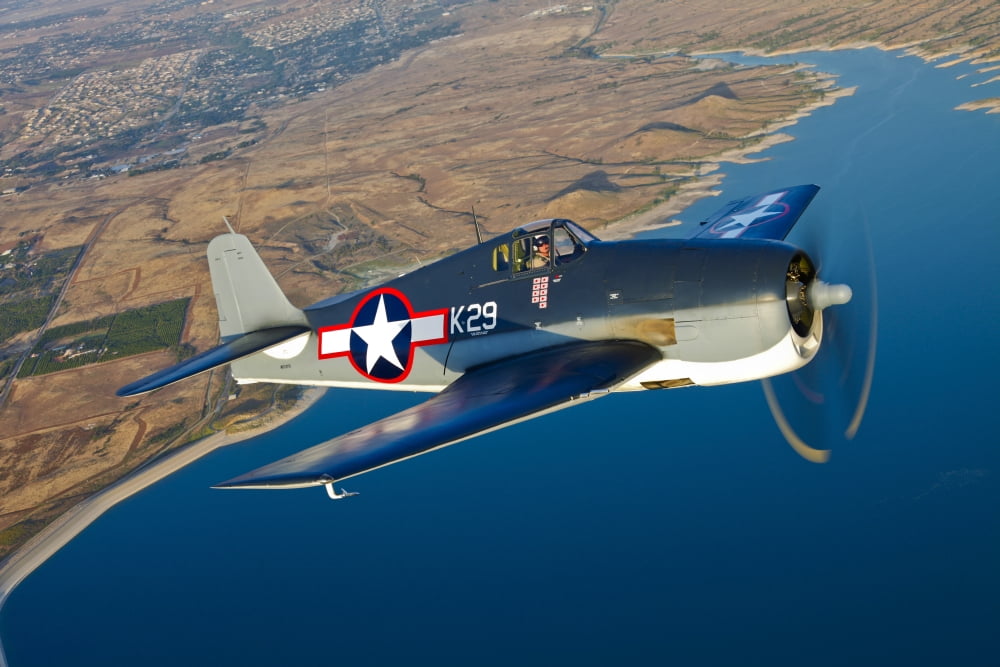 A Grumman F6F Hellcat fighter plane in flight Canvas Art - Scott GermainStocktrek Images (18 x 12)