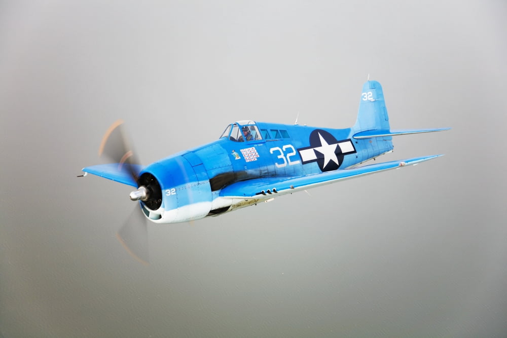 A Grumman F6F Hellcat fighter plane in flight Canvas Art - Scott GermainStocktrek Images (18 x 12)