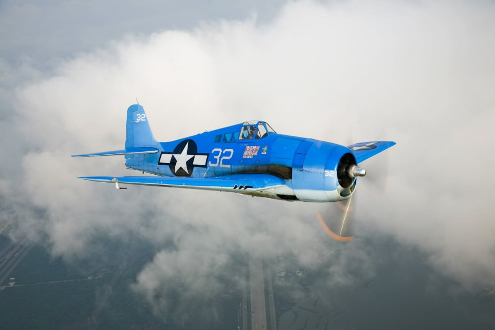 A Grumman F6F Hellcat fighter plane in flight Canvas Art - Scott GermainStocktrek Images (18 x 12)