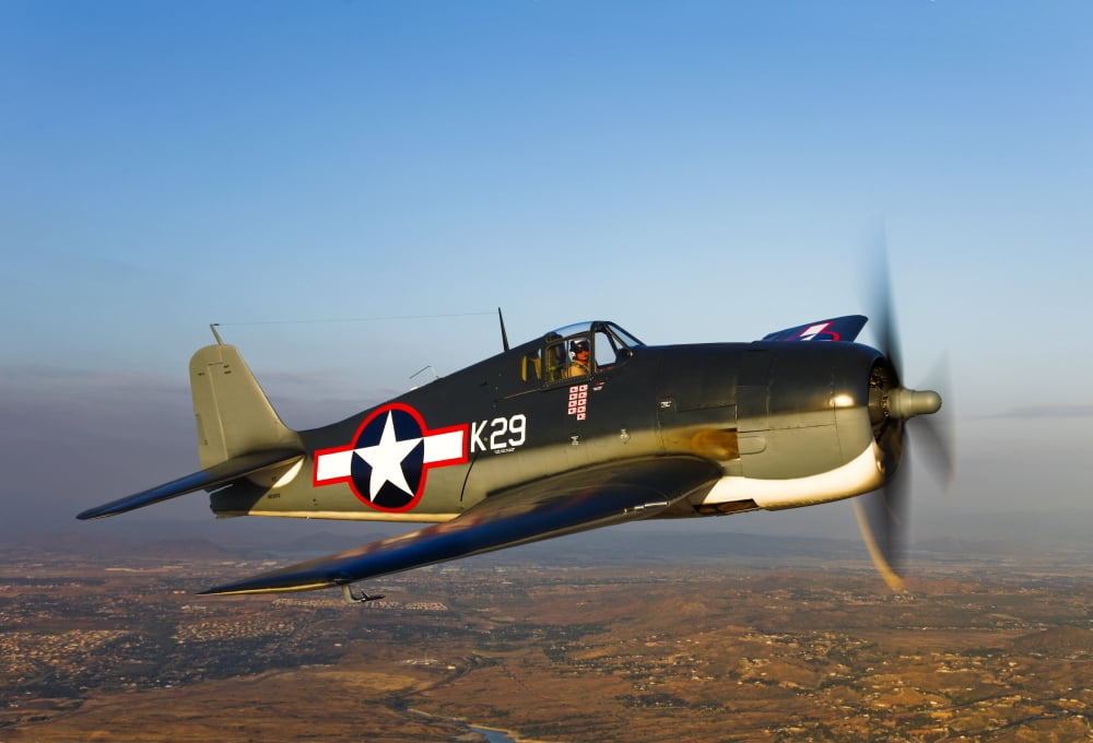 A Grumman F6F Hellcat fighter plane in flight Canvas Art - Scott GermainStocktrek Images (34 x 23)