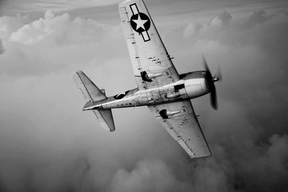 A Grumman F6F Hellcat fighter plane in flight Canvas Art - Scott GermainStocktrek Images (35 x 23)