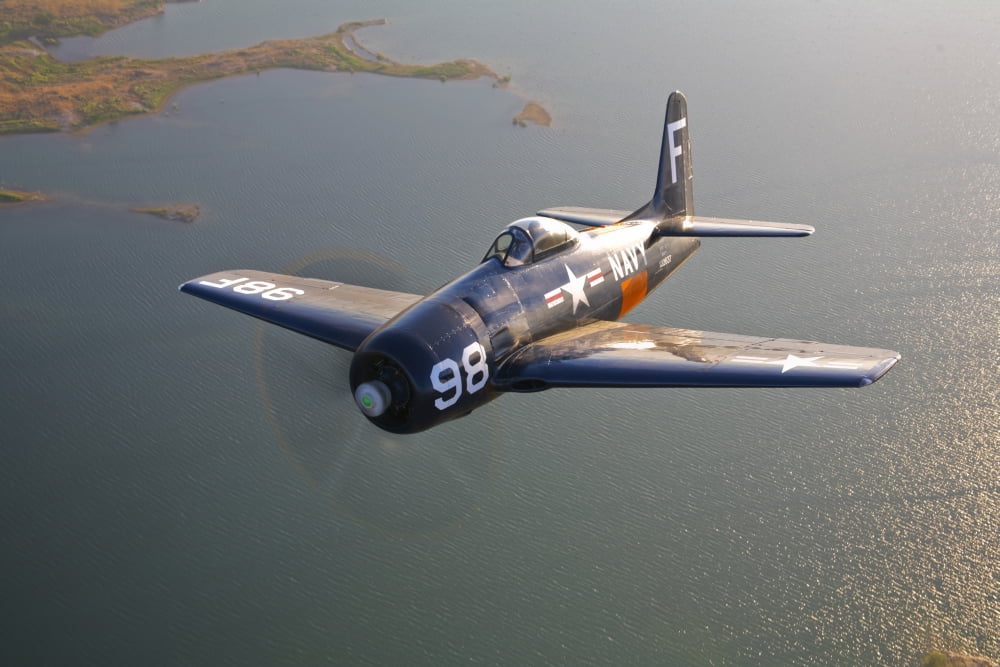 A Grumman F8F Bearcat in flight Canvas Art - Scott GermainStocktrek Images (18 x 12)