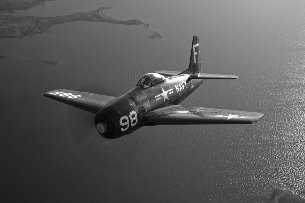 A Grumman F8F Bearcat in flight Canvas Art - Scott GermainStocktrek Images (35 x 23)