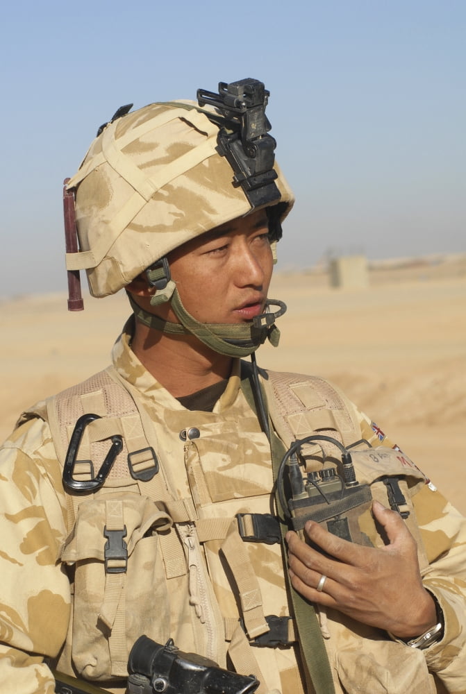 A Gurkha commander communicates on his personal radio Canvas Art - Andrew ChittockStocktrek Images (23 x 34)