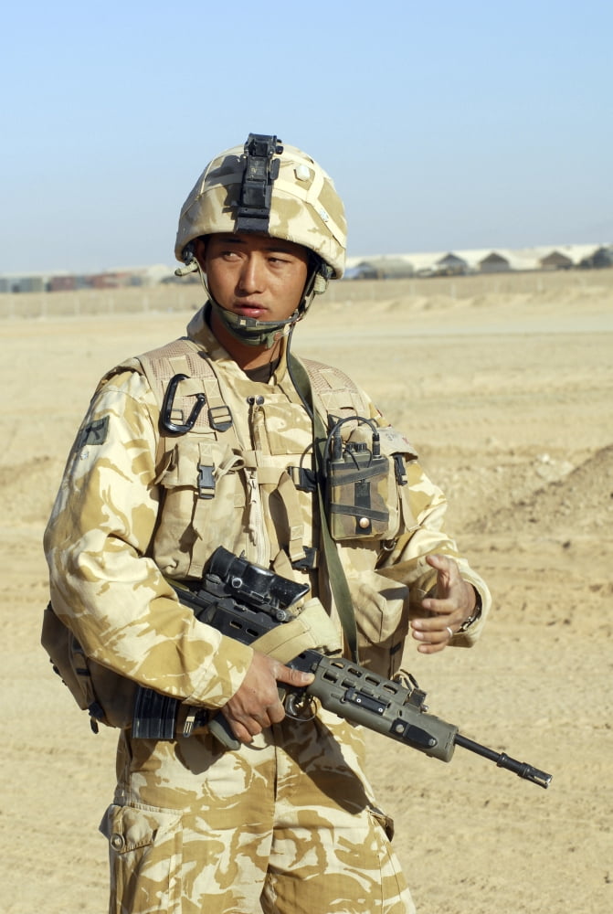 A Gurkha commander communicates on his personal radio Canvas Art - Andrew ChittockStocktrek Images (23 x 34)