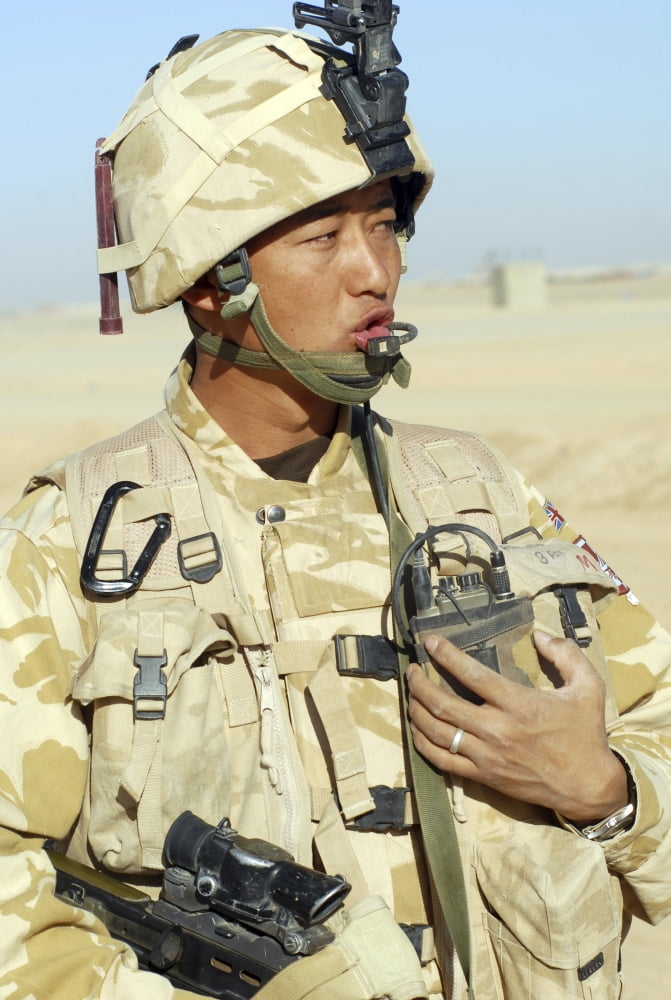 A Gurkha commander communicates on his personal radio Canvas Art - Andrew ChittockStocktrek Images (23 x 34)