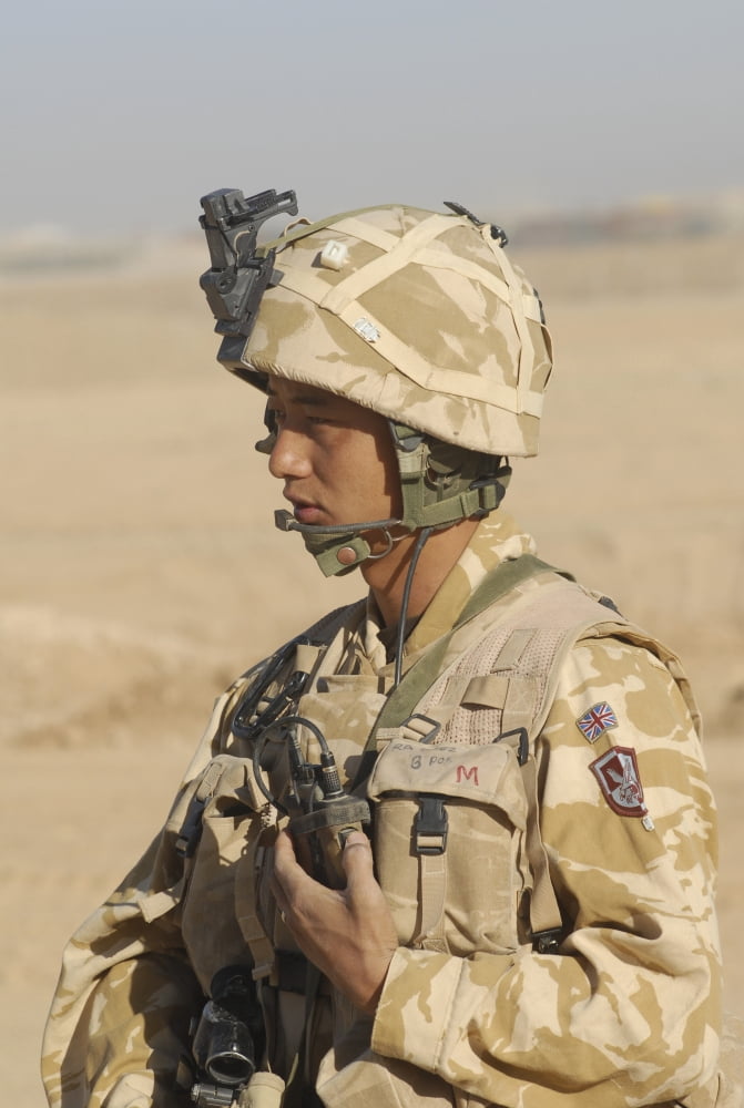 A Gurkha commander communicates on his personal radio Canvas Art - Andrew ChittockStocktrek Images (23 x 34)