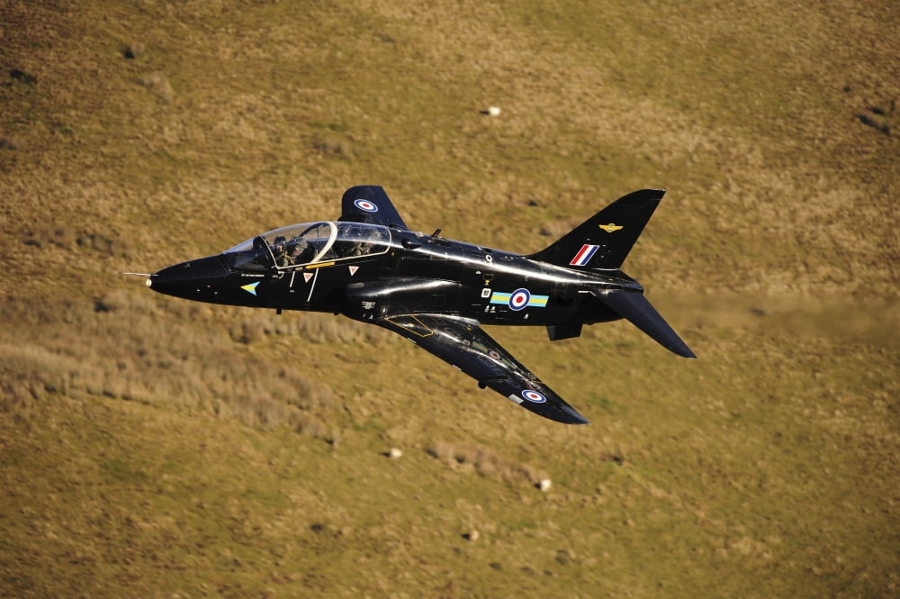 A Hawk T1 trainer aircraft of the Royal Air Force low flying over North Wales Canvas Art - Andrew ChittockStocktrek Images (17 x 12)