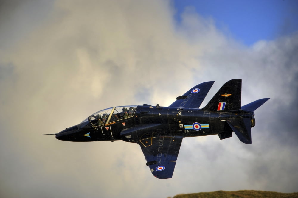 A Hawk T1 trainer aircraft of the Royal Air Force low flying over North Wales Canvas Art - Andrew ChittockStocktrek Images (34 x 23)