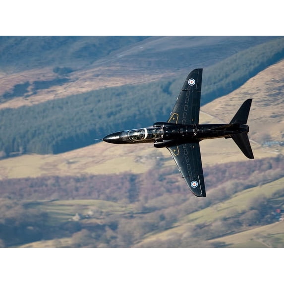 A Hawk T1 trainer aircraft of the Royal Air Force low flying over North Wales Poster Print by Andrew Chittock/Stocktrek Images (34 x 22)