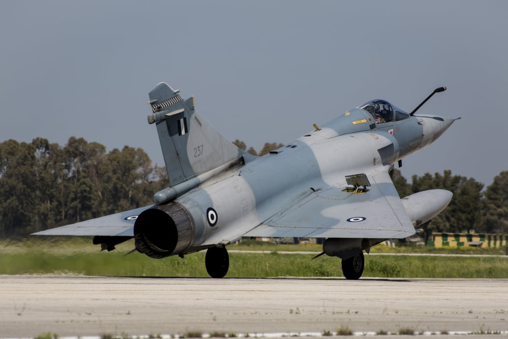 A Hellenic Air Force Mirage 2000 EGM landing in Andravida Greece Canvas Art - Timm ZiegenthalerStocktrek Images (34 x 23)