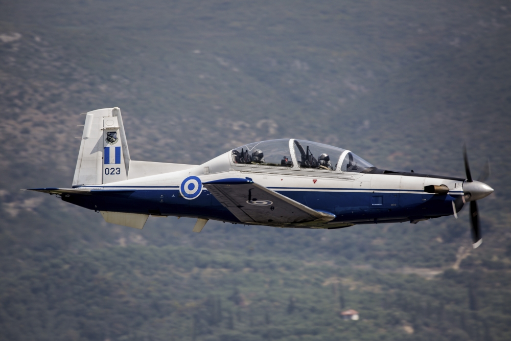 A Hellenic Air Force T-6 trainer flying over Kalamata Greece Canvas Art - Timm ZiegenthalerStocktrek Images (17 x 12)