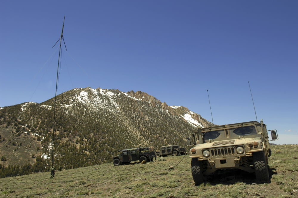 A Humvee is parked at the re-transmitting site at the Mountain Warfare Training Center in California Canvas Art - Stocktrek Images (34 x 23)