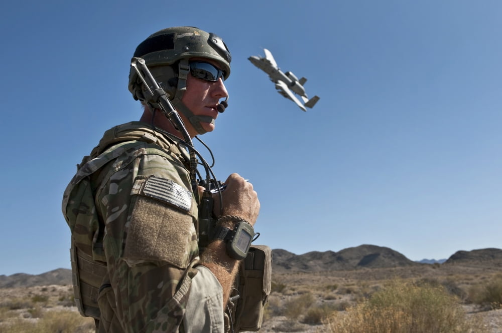A Joint Terminal Attack Controller uses a radio to communicate with pilots of A-10 Thunderbolt IIs Canvas Art - Stocktrek Images (35 x 23)