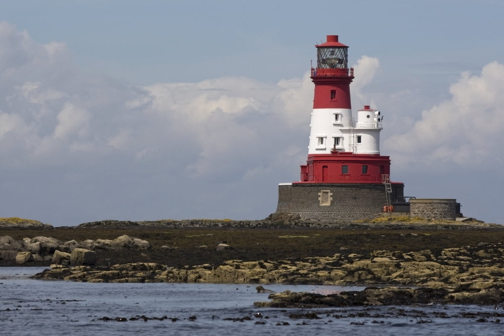 A Lighthouse On A Shoreline Canvas Art - John Short Design Pics (38 x 24)