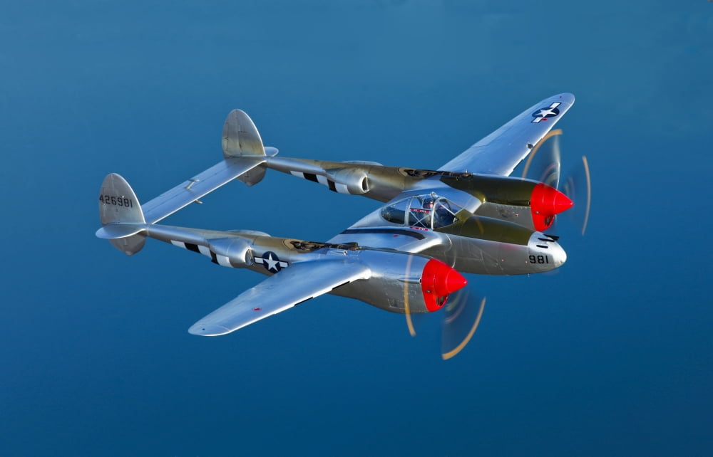 A Lockheed P-38 Lightning fighter aircraft in flight Canvas Art - Scott GermainStocktrek Images (18 x 12)