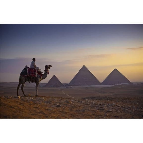 A Lone Camel & Rider Stand in Front of The Setting Sun with The Great Pyramids Behind Them - Giza Egypt Poster Print by Matt Brandon, 38 x 24 - Large