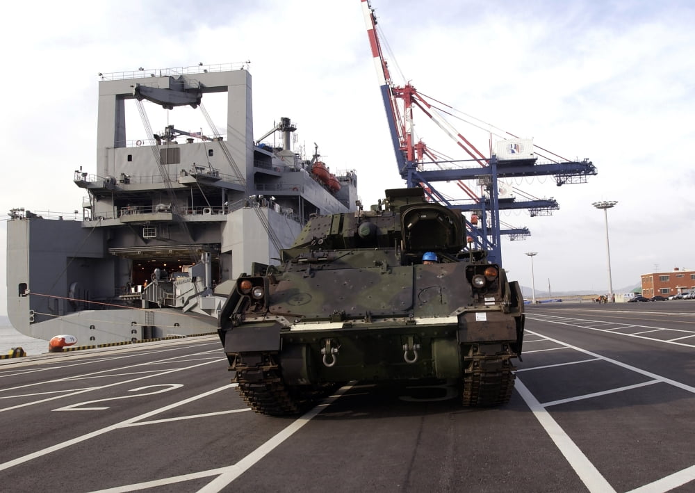 A M1A1 Abrams main battle tank is prepared for onload to the USNS Watson Canvas Art - Stocktrek Images (33 x 24)