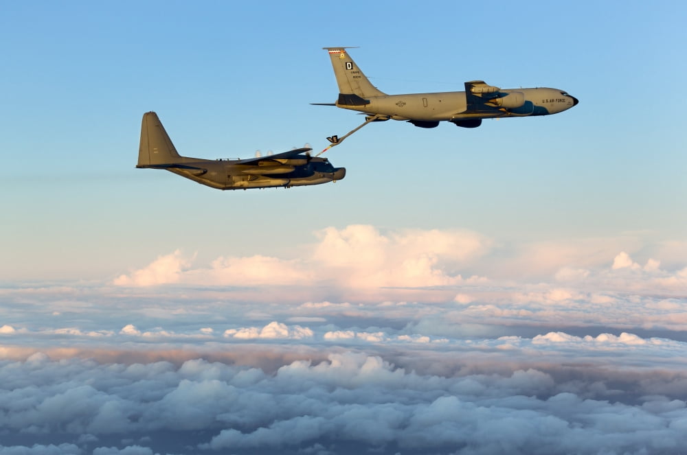 A MC-130H Combat Talon II being refueled by a KC-135R Stratotanker Canvas Art - Gert KromhoutStocktrek Images (18 x 12)