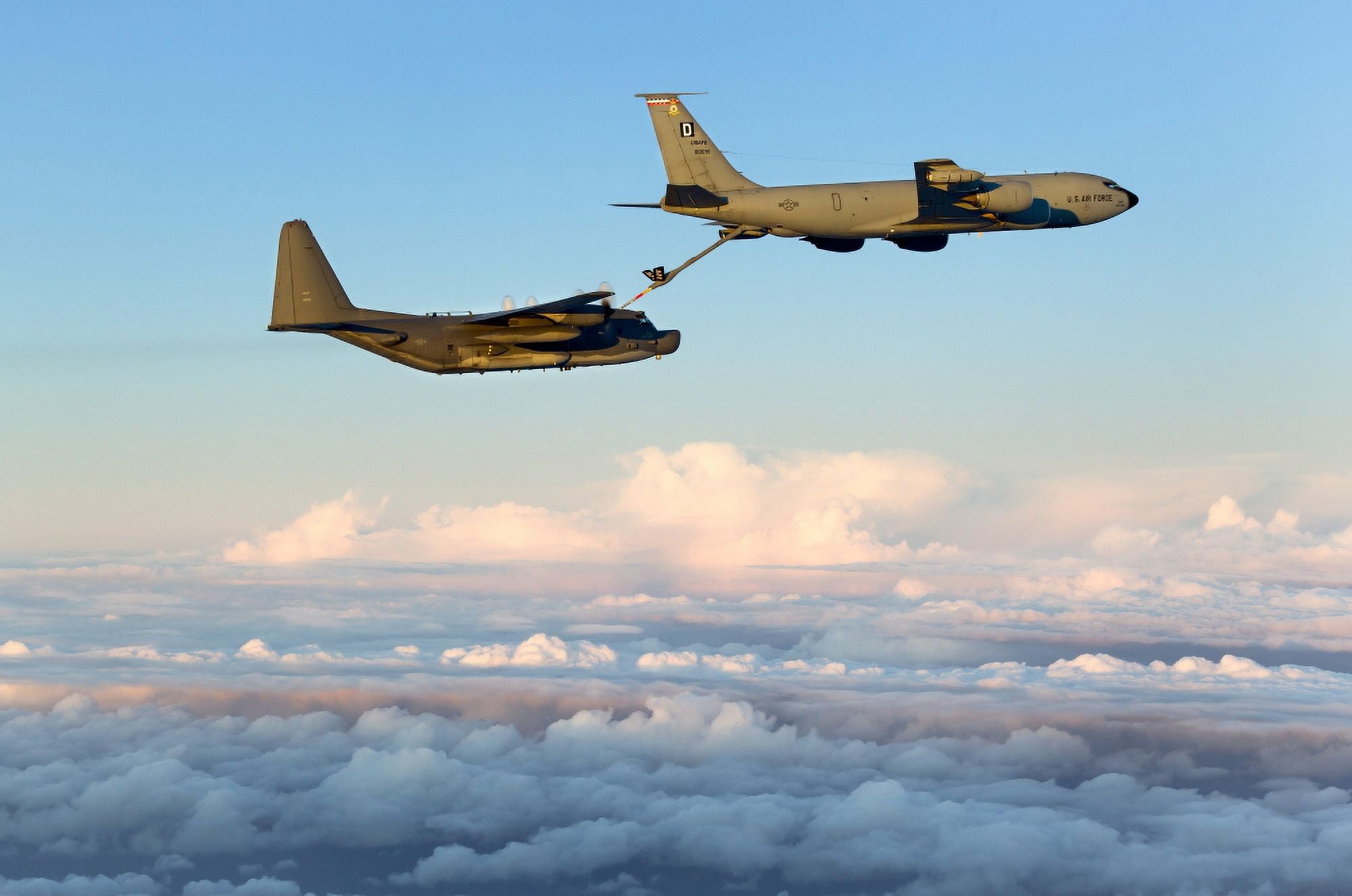 A MC-130H Combat Talon II being refueled by a KC-135R Stratotanker Canvas Art - Gert KromhoutStocktrek Images (35 x 23)