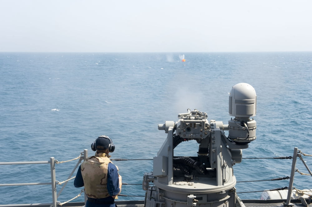 A MK-38 25mm machine gun is fired aboard USS William P Lawrence Canvas Art - Stocktrek Images (35 x 23)