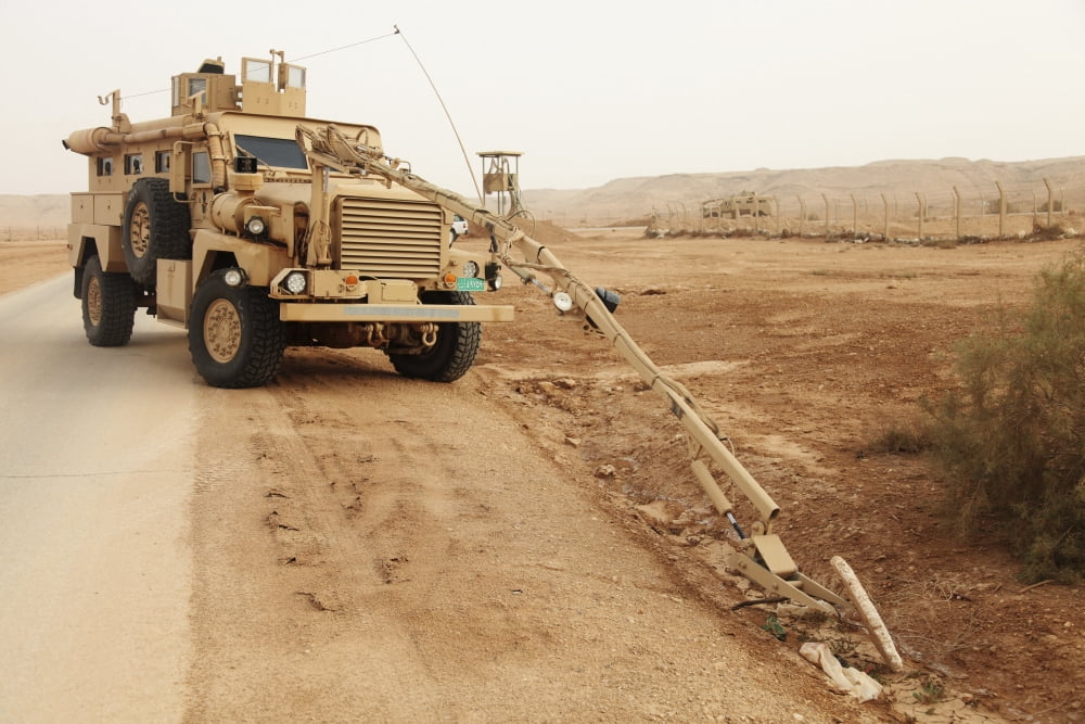 A MRAP vehicle disassembles an improvised explosive device Canvas Art - Stocktrek Images (35 x 23)