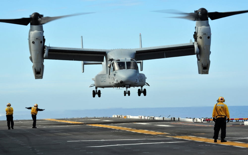 A MV-22 Osprey aircraft prepares to land on the flight deck Canvas Art - Stocktrek Images (35 x 22)