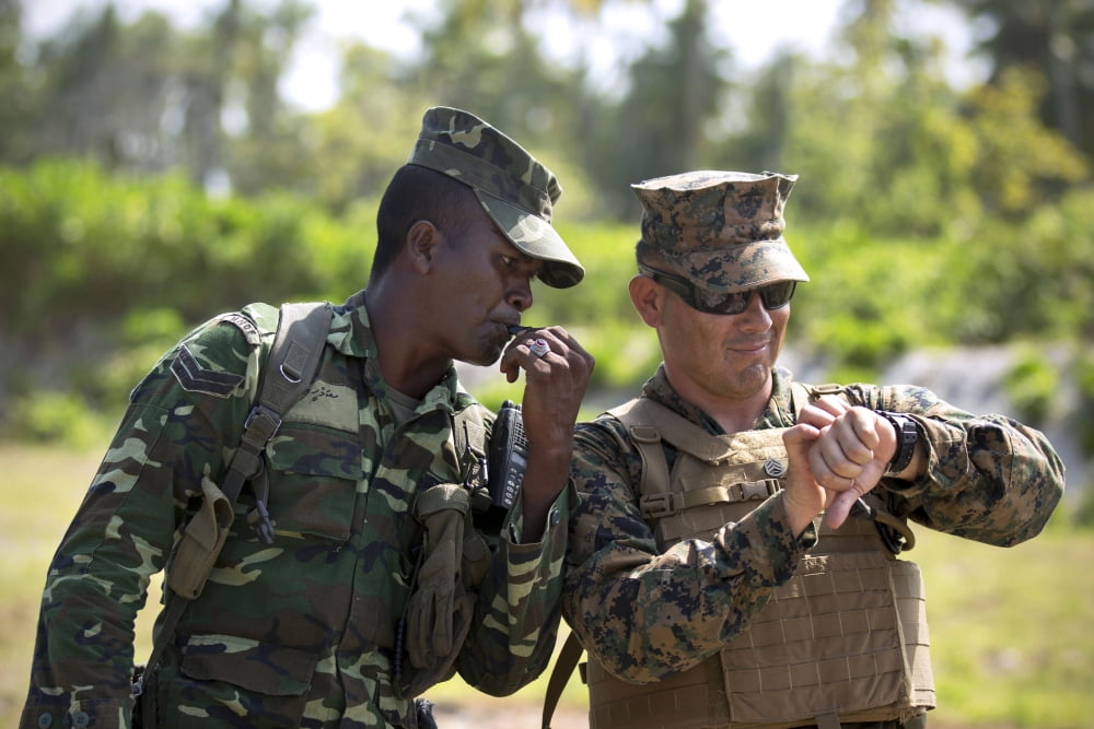 A Maldivian Marine and US Marine Canvas Art - Stocktrek Images (34 x 23)