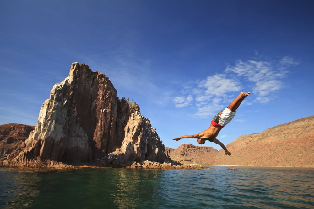 A Man Dives Into The Water Off Espiritu Santos Island Near La Paz Baja California Mexico Canvas Art - Stuart Westmorland Design Pics (38 x 24)