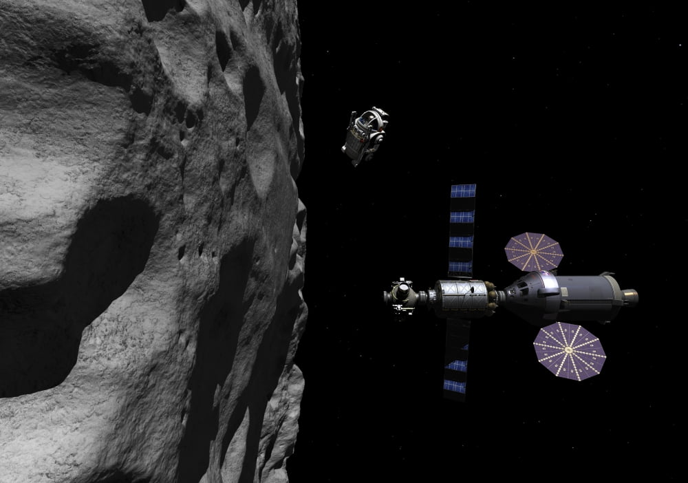 A Manned Maneuvering Vehicle descends toward the surface of a small asteroid Canvas Art - Walter MyersStocktrek Images (34 x 24)