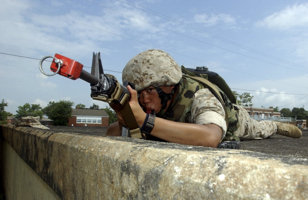 A Marine drinks from his CamelBak while he scans his position for enemy activity Canvas Art - Stocktrek Images (34 x 22)