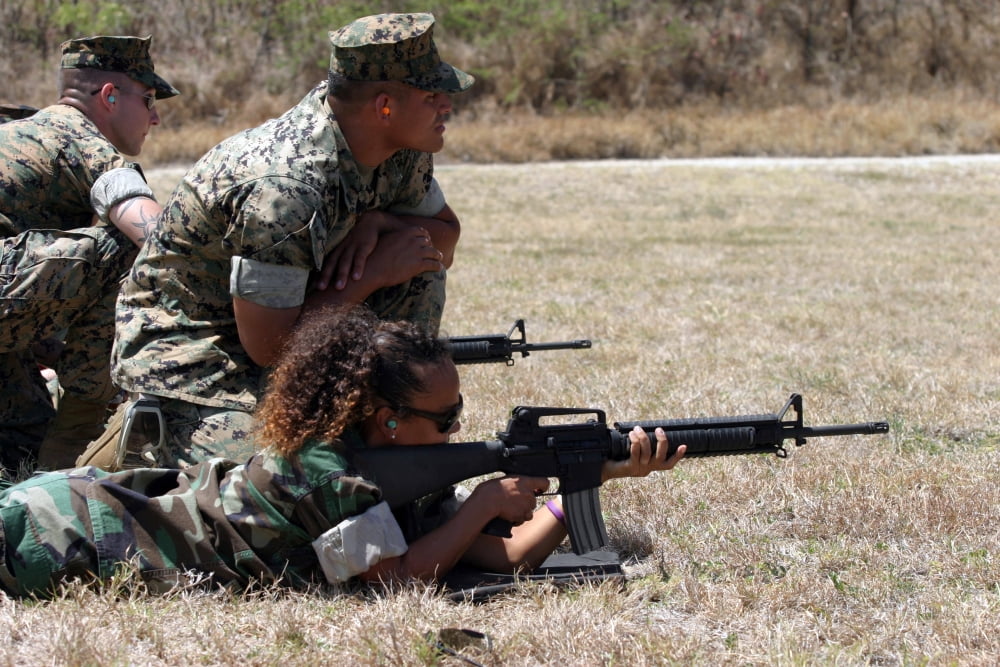 A Marine explains the proper techniques for firing the M16 Canvas Art - Stocktrek Images (34 x 23)