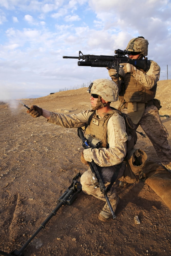 A Marine fires a M203 grenade launcher while fellow Marine fires a pin flare Canvas Art - Stocktrek Images (23 x 34)