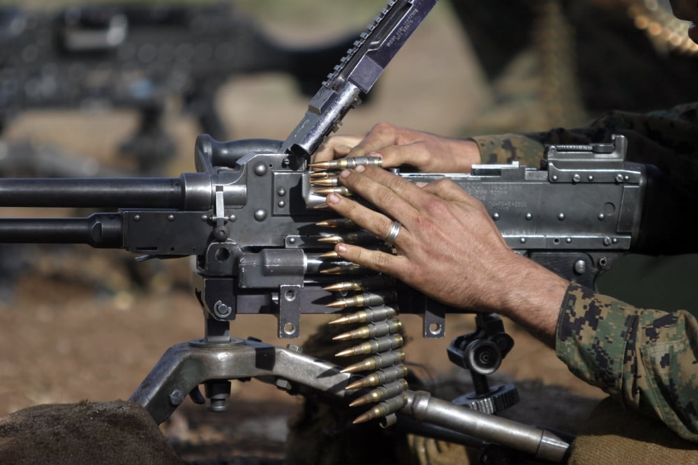 A Marine loads a M-240G machine gun Canvas Art - Stocktrek Images (34 x 23)