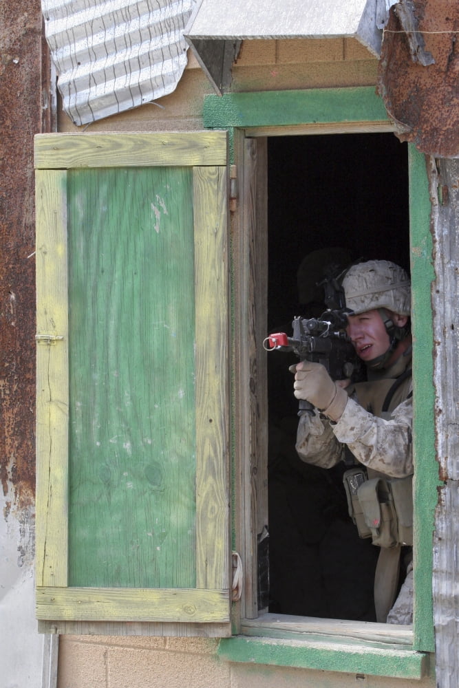 A Marine posts security out of a window Canvas Art - Stocktrek Images (23 x 34)