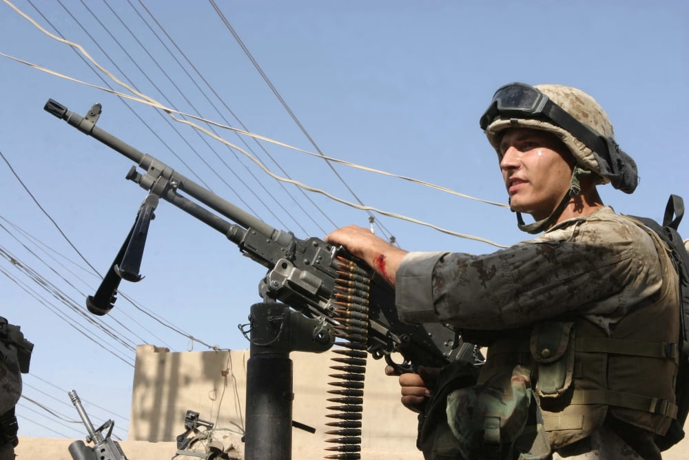 A Marine readies his weapon after an attack on the Iraqi police station in Al Kharma Iraq Canvas Art - Stocktrek Images (34 x 23)