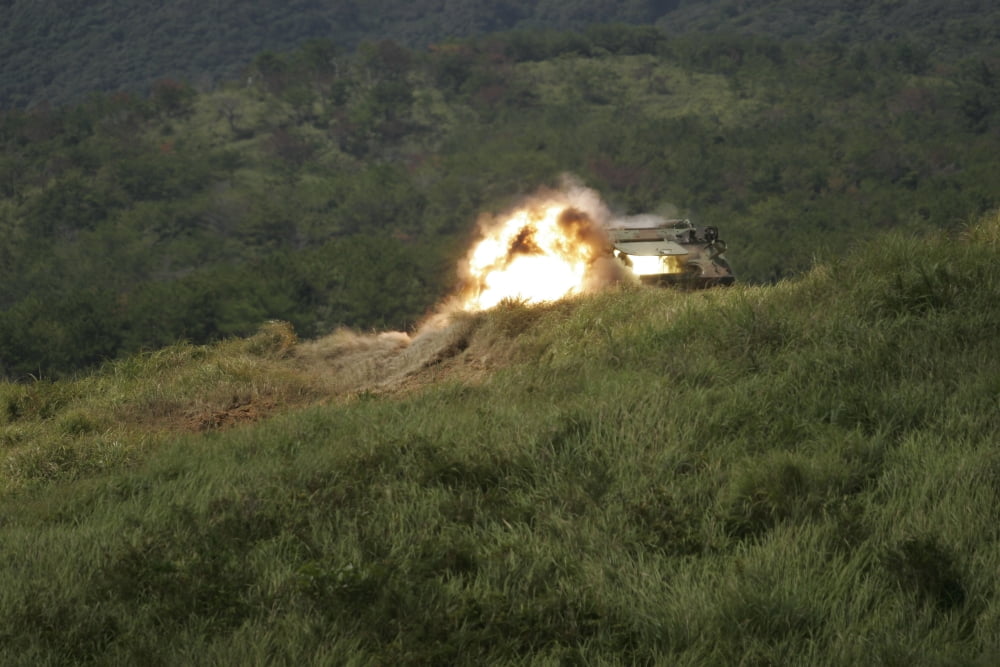 A Marine scores a direct hit while firing an AT-4 at an armored personnel carrier Canvas Art - Stocktrek Images (34 x 23)