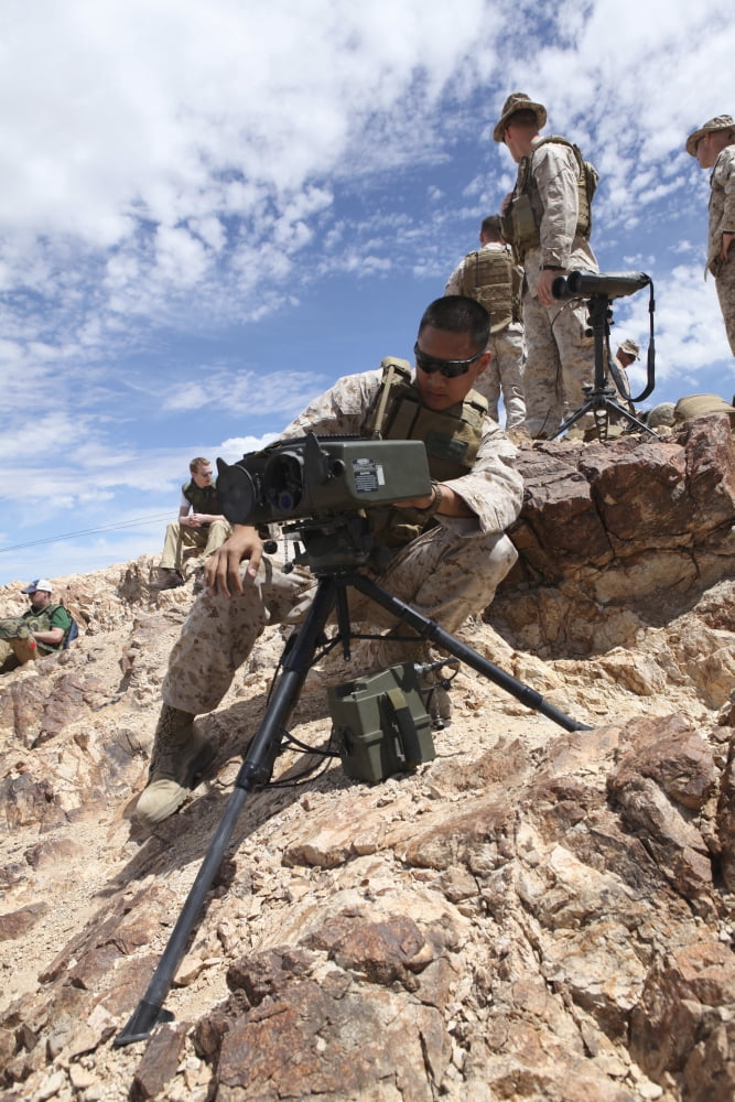A Marine sets up a laser designator on the Chocolate Mountains Canvas Art - Stocktrek Images (23 x 34)