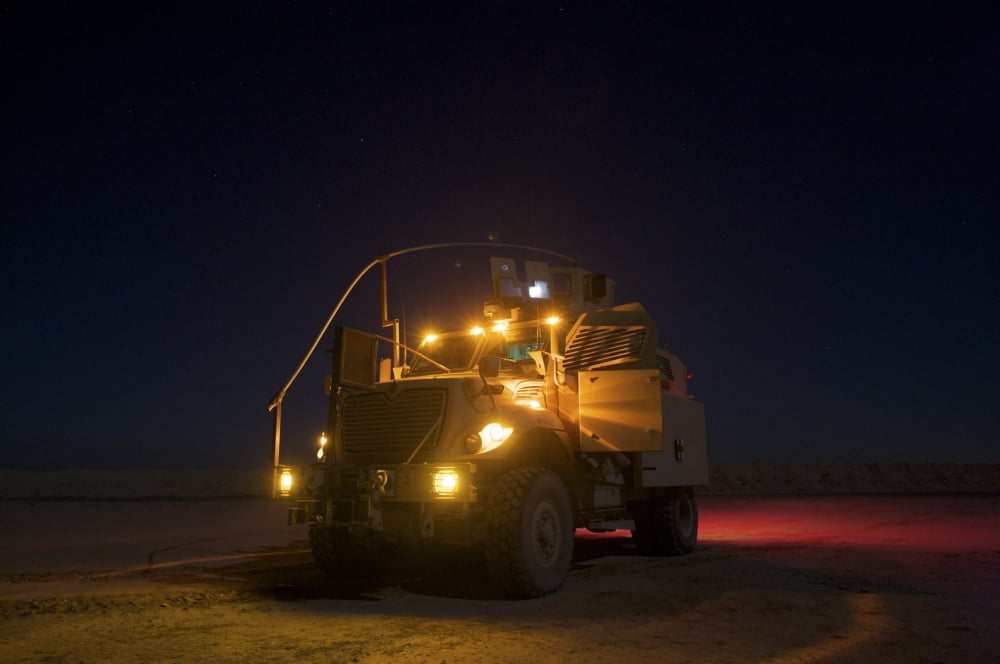 A MaxxPro MRAP vehicle with running lights on at night Canvas Art - Terry MooreStocktrek Images (35 x 23)