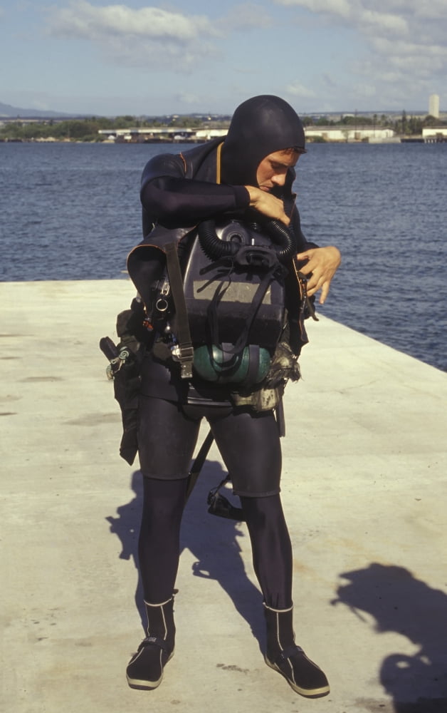 A Navy SEAL puts on gear in preparation for combat swimmer training Canvas Art - Michael WoodStocktrek Images (23 x 36)