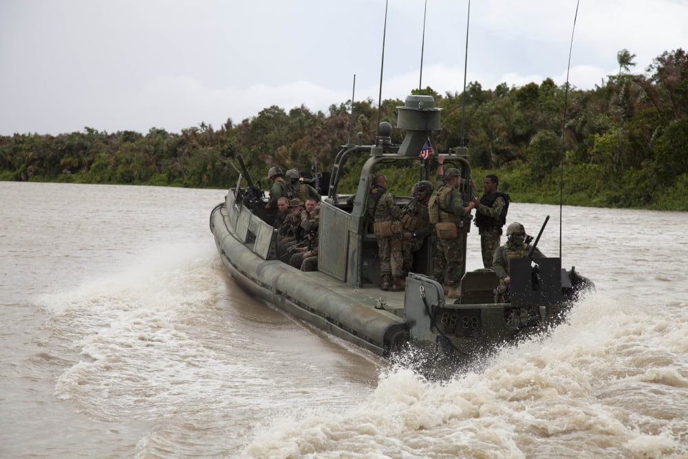 A Navy riverine patrol boat conducts amphibious assault exercise in Turbo Colombia Canvas Art - Stocktrek Images (35 x 23)